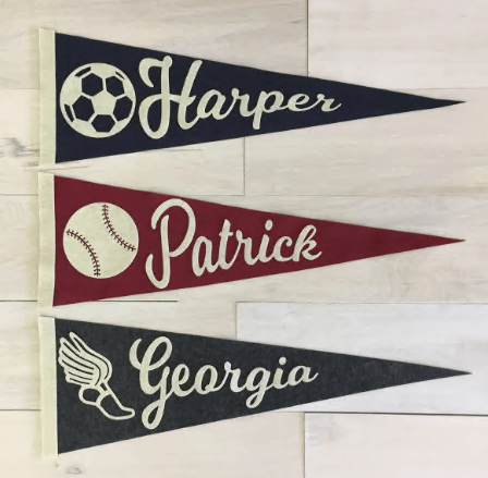 Personalized baseball pennants with player names and numbers