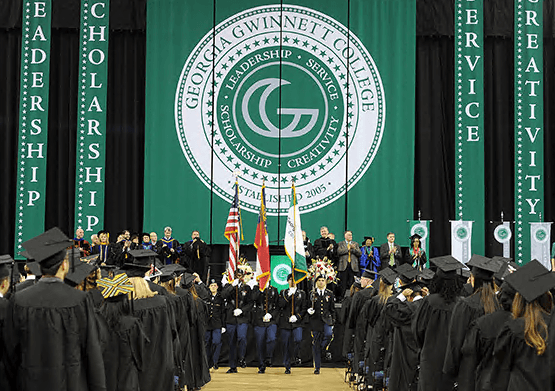 Large vertical hanging banners on a graduation stage for school ceremonies